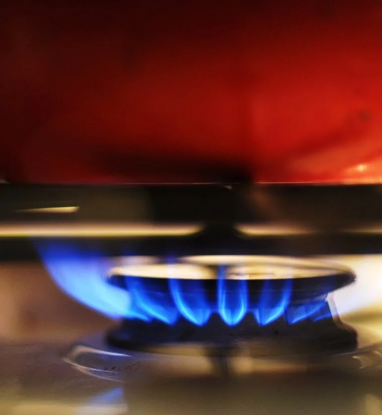 image of a lighted gas cooktop