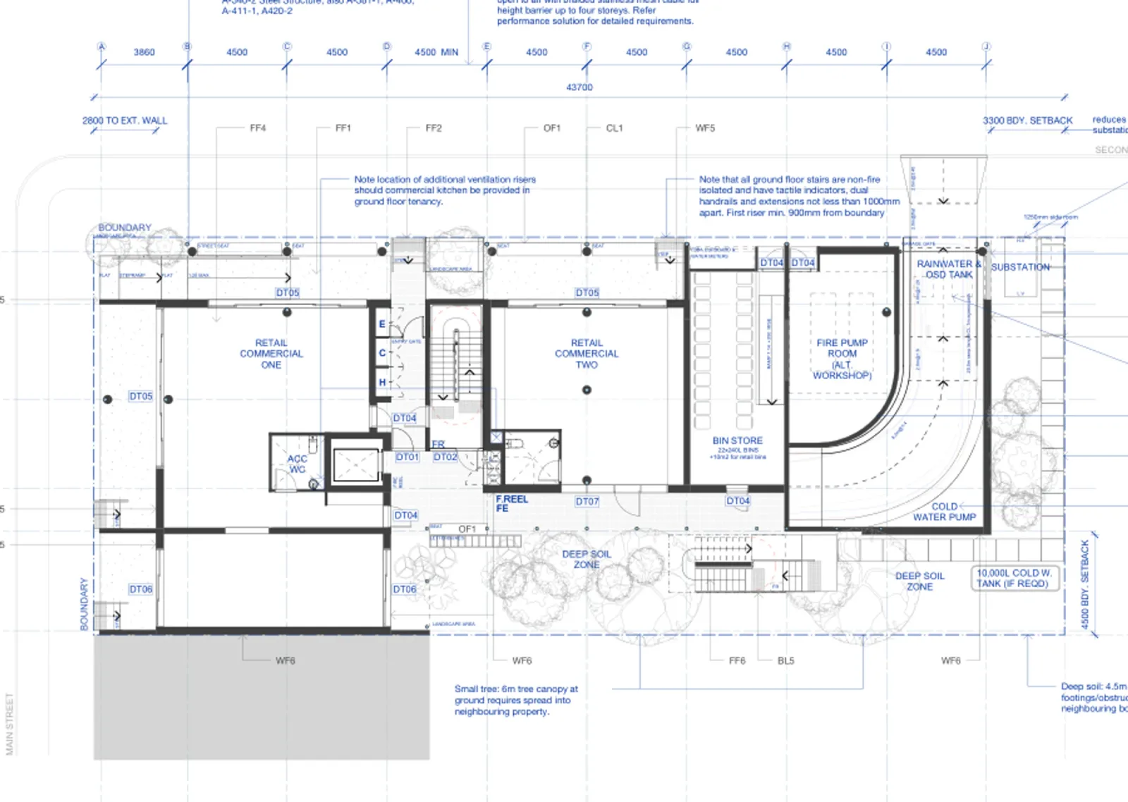 Ground floor plan showing two commercial tenancies, the residential entry, service rooms, landscaped edges and the ramp down to the basement