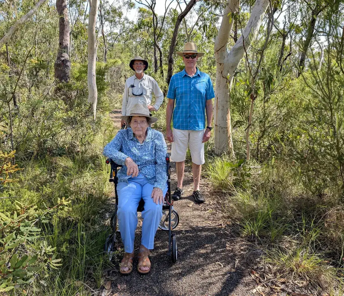 Three generations walking the flat accessible track to Bulgandry engravings