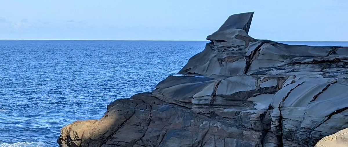 Shark Fin Rock formation on the rock platform at Winney Bay