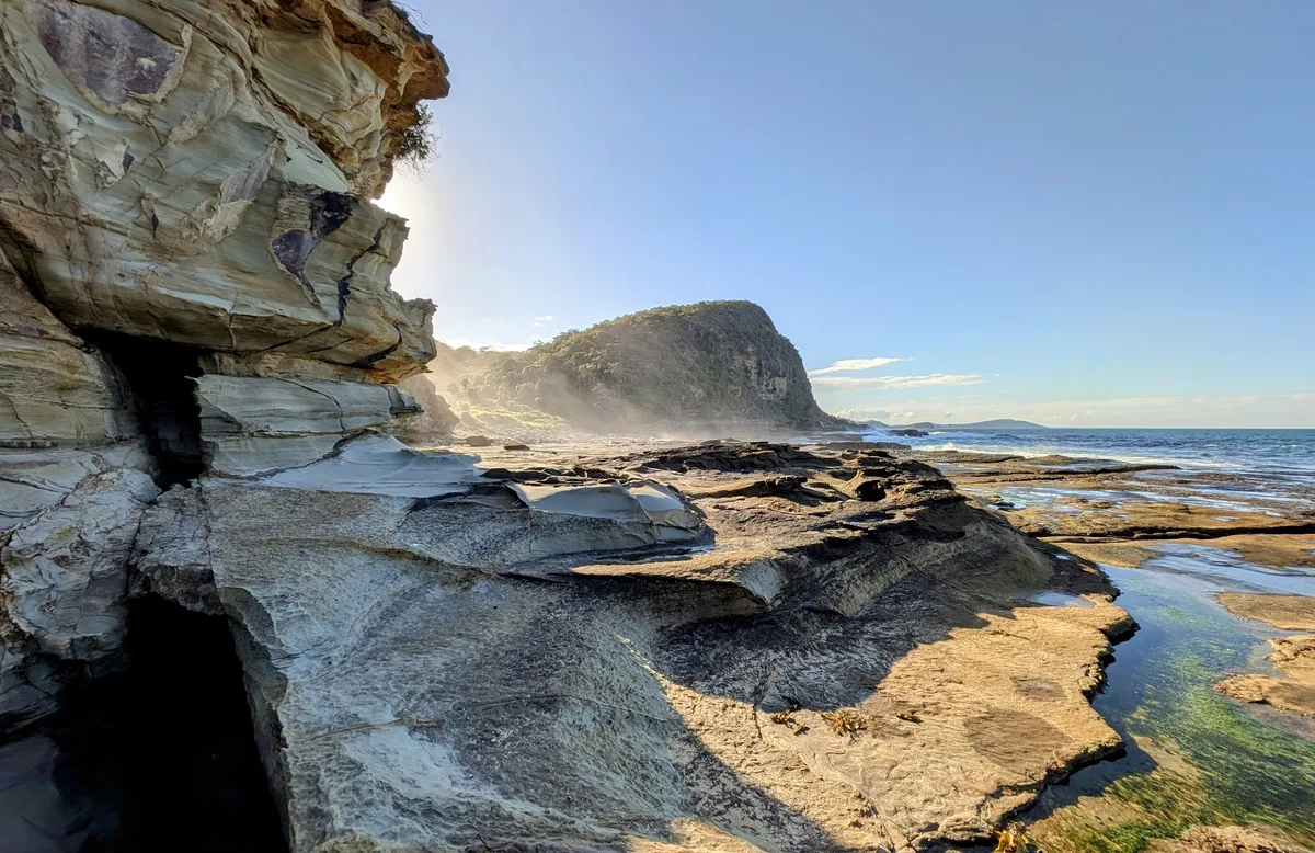 Sandstone cliffs and headland framing the coastline at Winney Bay