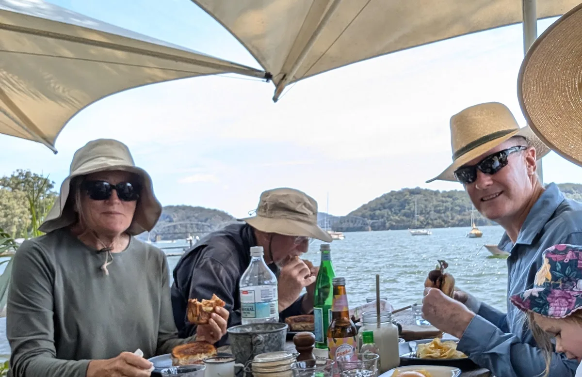 Family eating lunch at the waterside cafe on Dangar Island