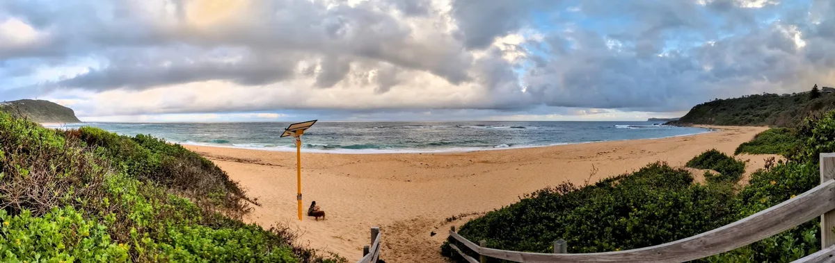 Panoramic view over Forresters Beach from the dune entrance path