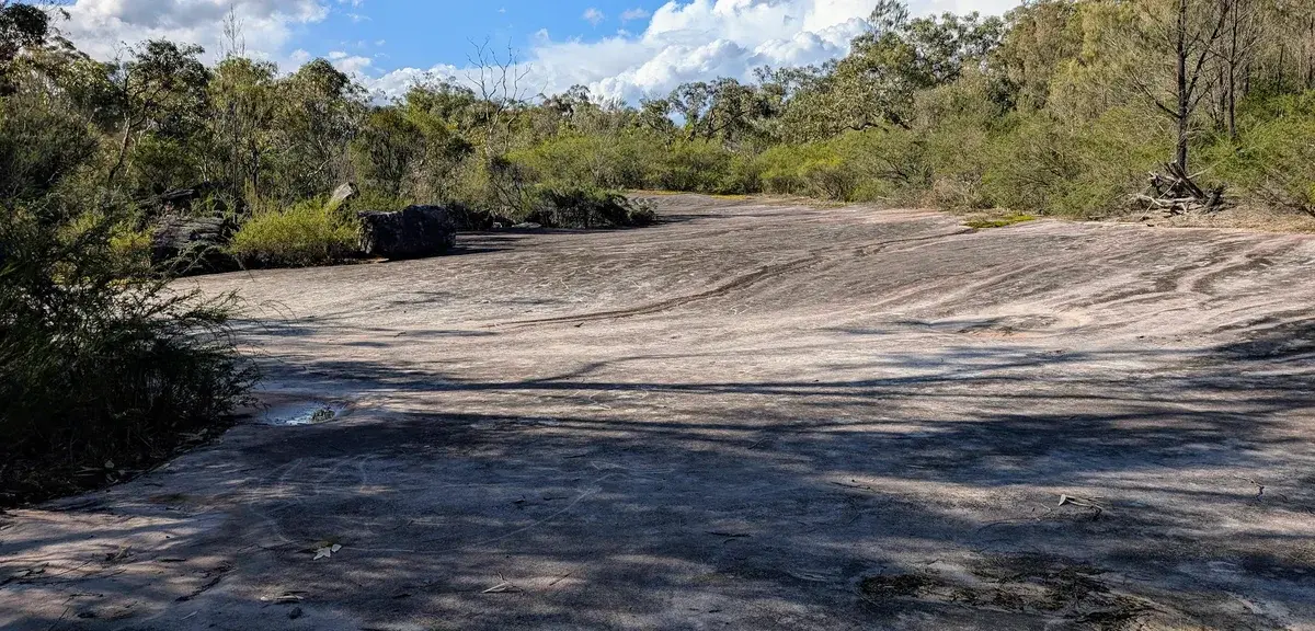 Wide sandstone clearing along the ridgeline near Megacave