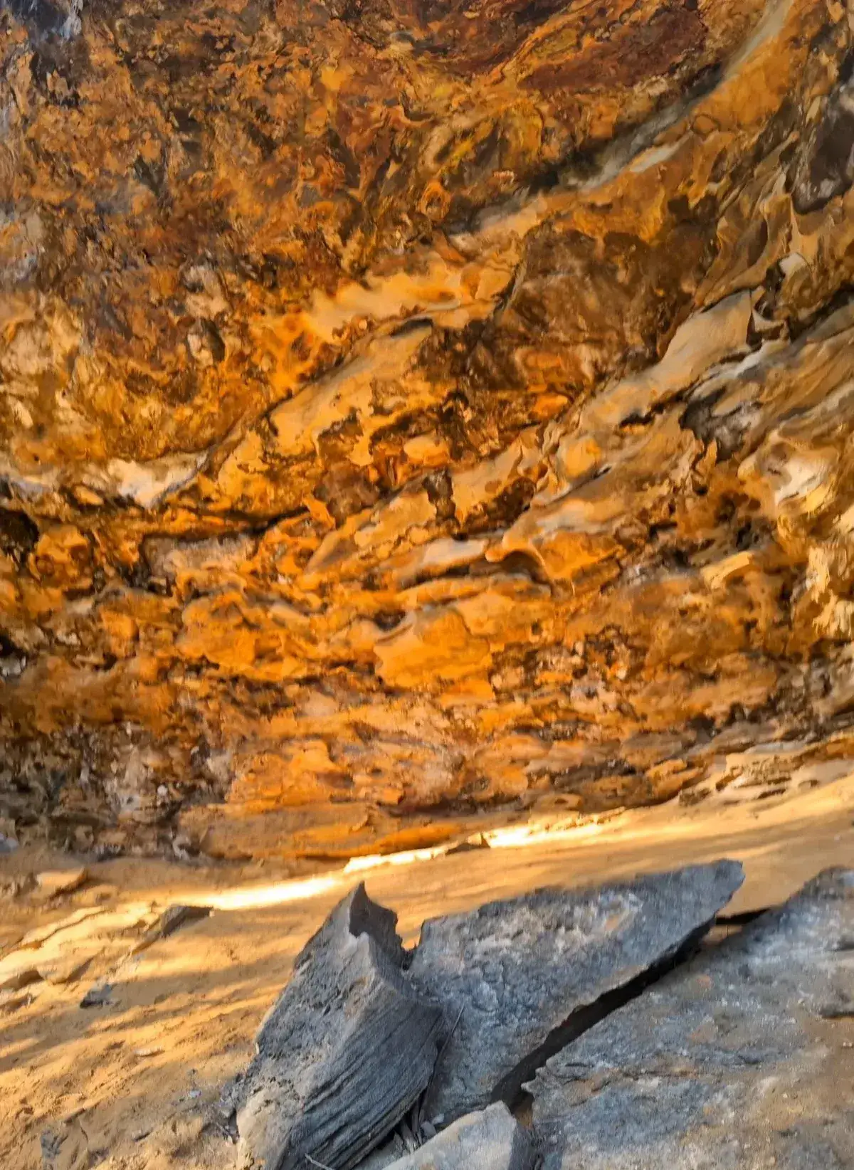 Rust coloured rock ceiling inside the Somersby megacave