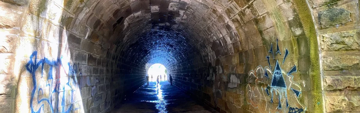 Sandstone tunnel carrying Mullet Creek under the railway line near Woy Woy