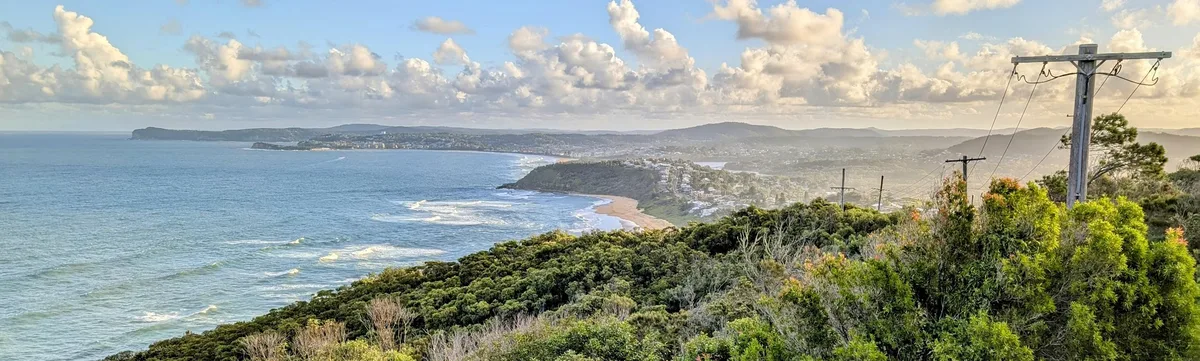 Panoramic dawn view along the Wyrrabalong coastline from Crackneck Point