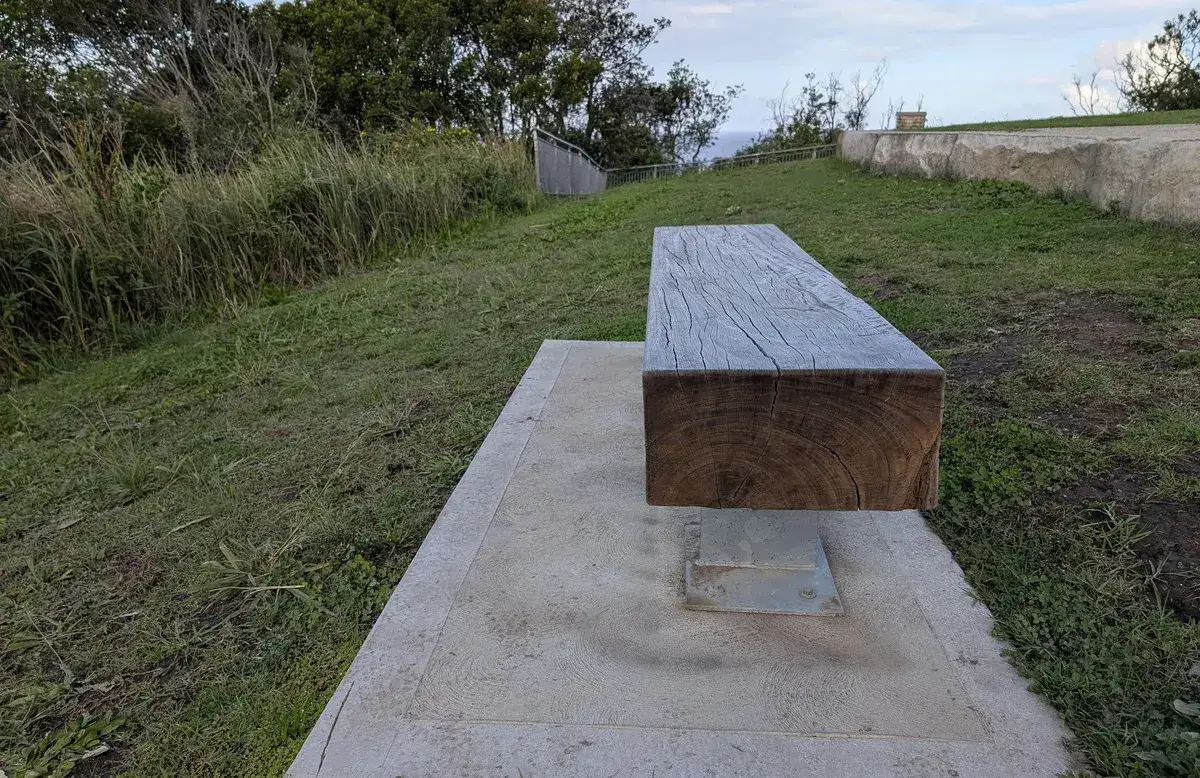 Timber lookout bench overlooking the ocean along the coastal walk